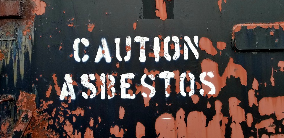 caution asbestos painted sign